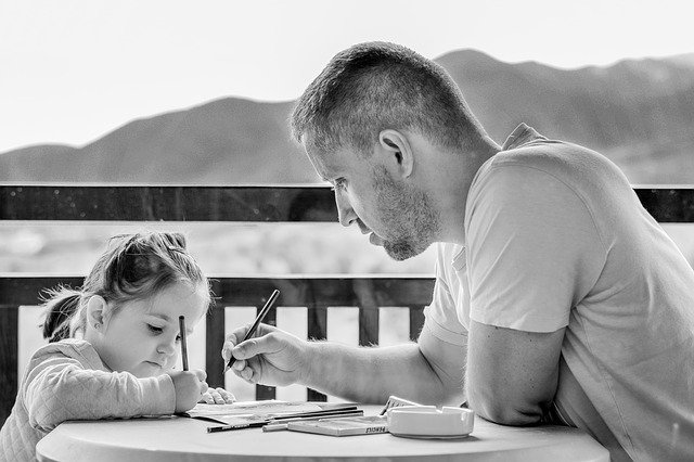 Girl and dad doing homework - back to school