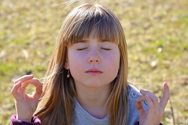 Girl meditating - back to school